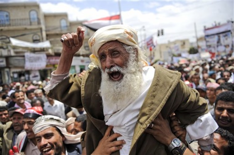 An elderly anti-government protestor reacts during a demonstration demanding the resignation of Yemeni President Ali Abdullah Saleh, in Sanaa,Yemen, Saturday, March 26, 2011. The White House urged governments in Syria, Yemen and Bahrain to cease attacks on protesters Friday, while saying the violence against protesters in those countries have not risen to the same level as in Libya, where Western.forces are engaged in military action to stop violence perpetrated by forces loyal to Moammar Gadhafi. (AP Photo/Hani Mohammed)